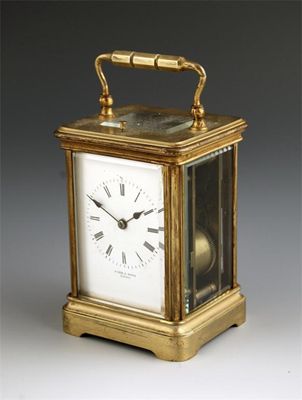 Appraisal: A gilt brass repeating carriage clock with a platform lever