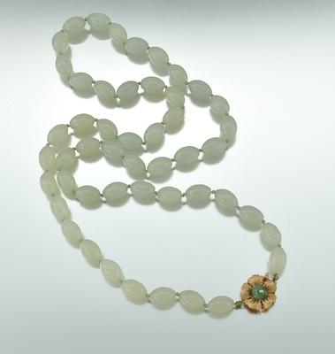 Appraisal: A Carved Stone Bead Necklace with Gold Clasp k yellow