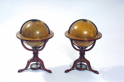 Appraisal: A pair of Regency table globes sold by W S