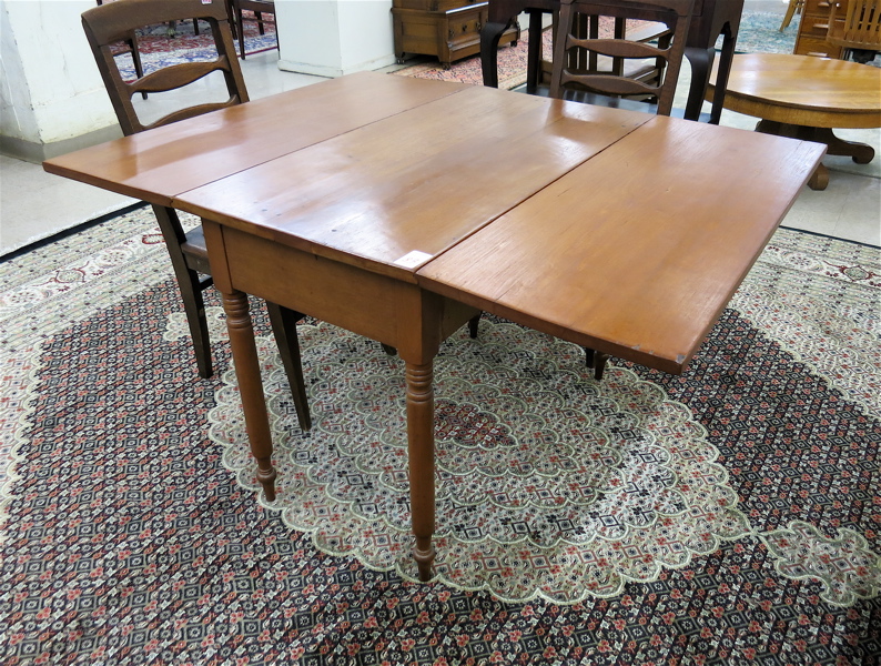 Appraisal: ANTIQUE DROP-LEAF CHERRY WOOD DINING TABLE American late th century