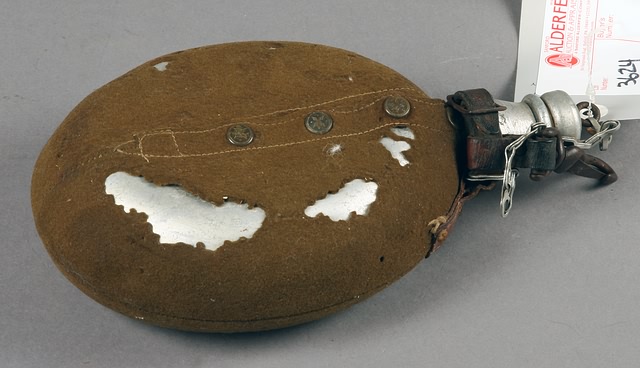 Appraisal: Belgium canteen with cover and hanger some mothing