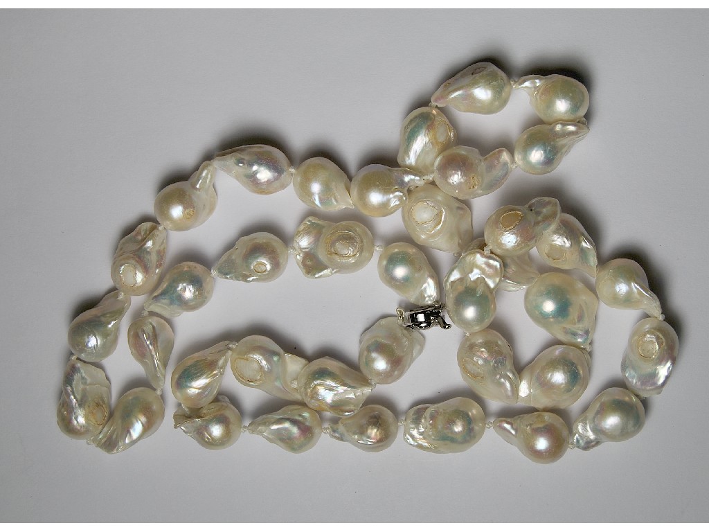 Appraisal: Single row of large baroque cultured pearls on silver flower