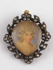 Appraisal: An antique gold and silver brooch with pendant fitting the