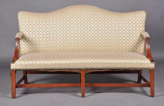 Appraisal: GEORGE III CARVED MAHOGANY SETTEE With serpentine-padded back the armrests