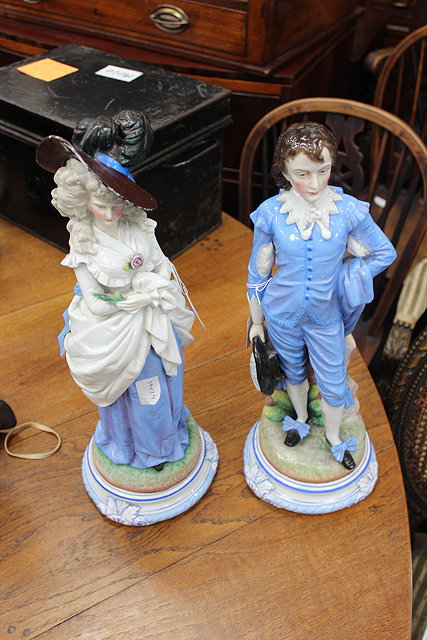 Appraisal: A PAIR OF CONTINENTAL PORCELAIN FIGURES of a courtly couple