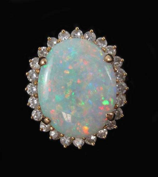 Appraisal: OPAL DIAMOND AND EIGHTEEN KARAT GOLD RING with round-cut diamonds