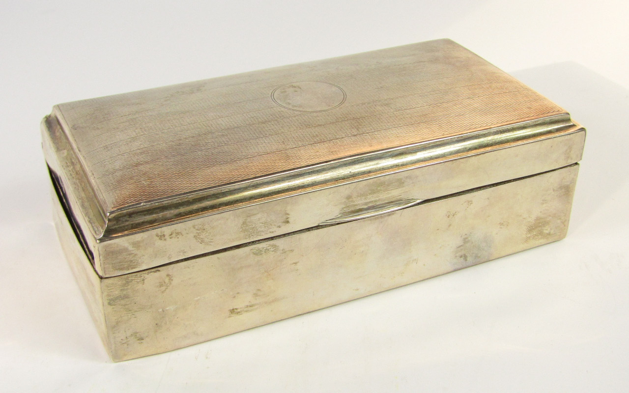 Appraisal: A George V silver twin division cigarette box with engine