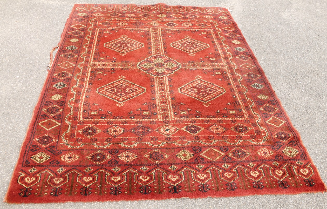 Appraisal: A thC rug in floral pattern predominantly in red blue