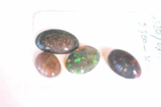 Appraisal: A COLLECTION OF FOUR LOOSE TREATED OPALS