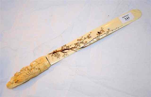 Appraisal: A JAPANESE IVORY PAGE TURNER with shibyama lacquer decoration of