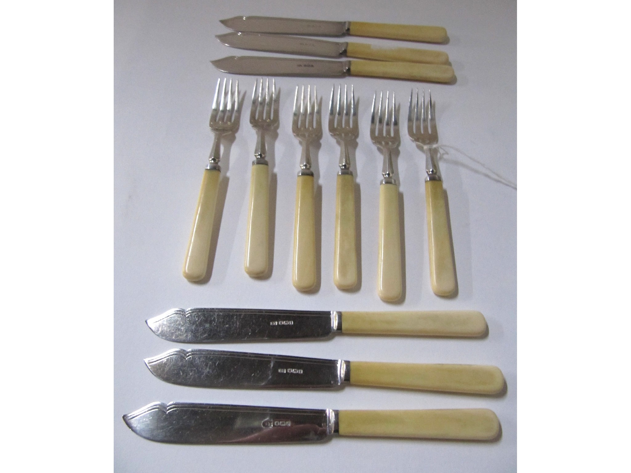 Appraisal: A twelve piece silver and bone handled fish cutlery set