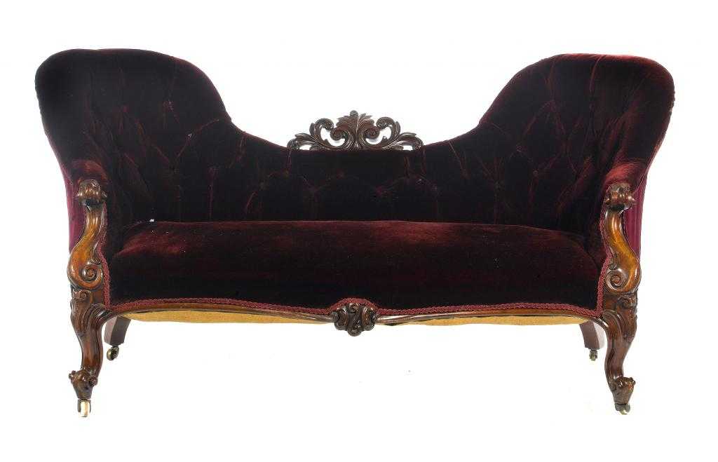 Appraisal: A VICTORIAN MAHOGANY SOFA of serpentine form the back crested