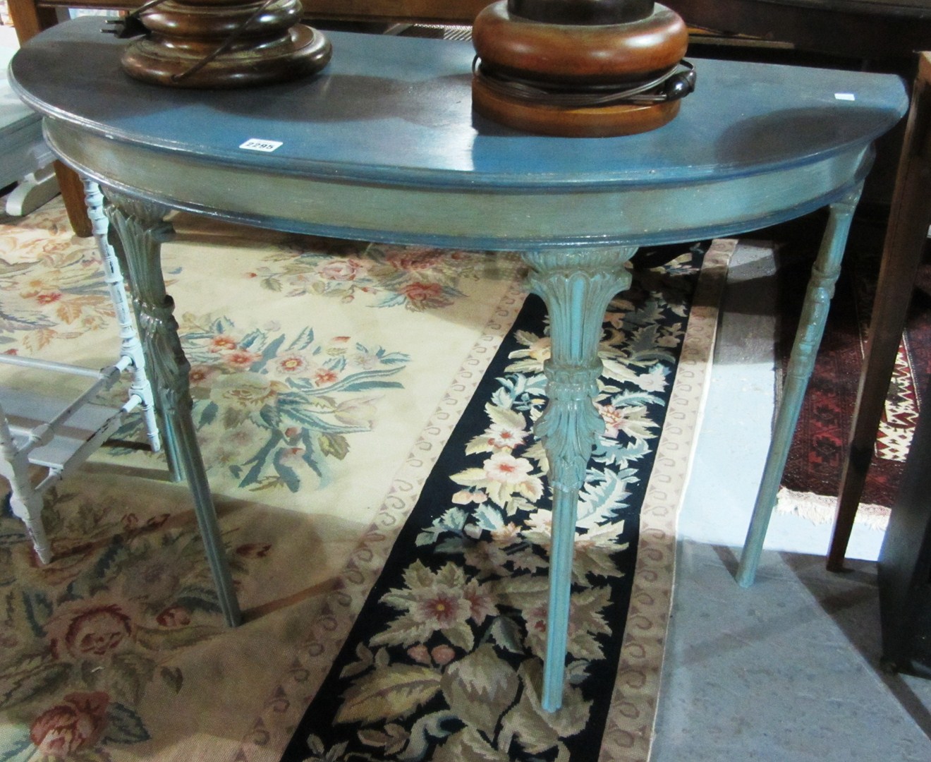 Appraisal: A blue painted demi-lune console table