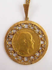 Appraisal: A George V gold sovereign coin dated loose mounted as