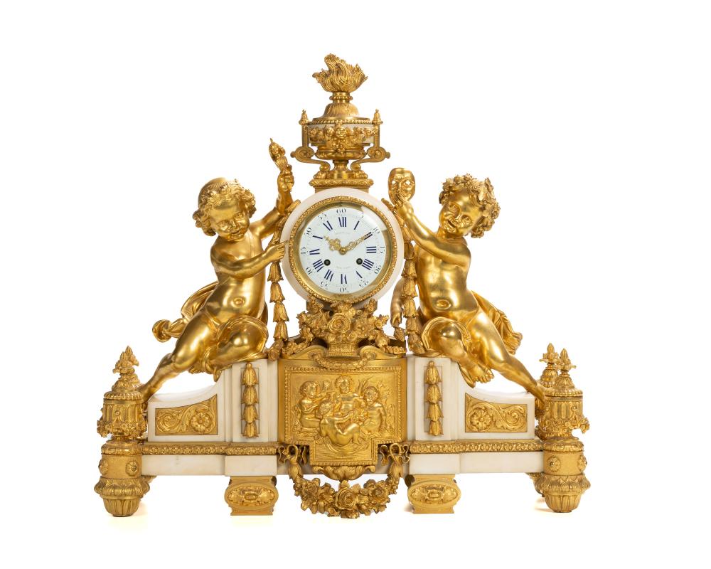 Appraisal: A French gilt-bronze and marble mantel clock retailed by Tiffany