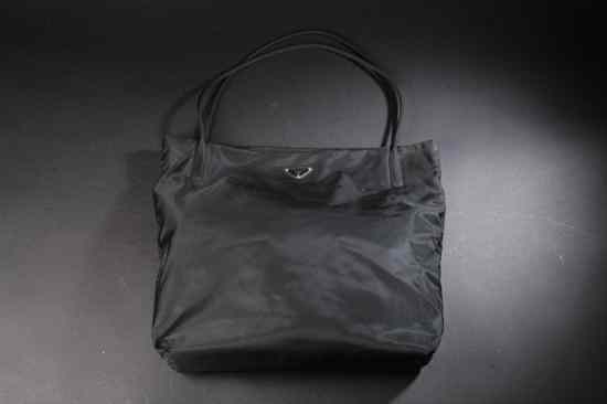 Appraisal: PRADA BLACK NYLON HANDBAG Single interior compartment with zipper side