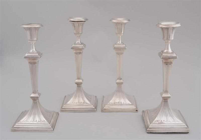 Appraisal: SET OF FOUR GEORGE III WEIGHTED SILVER TABLE CANDLESTICKS Marks