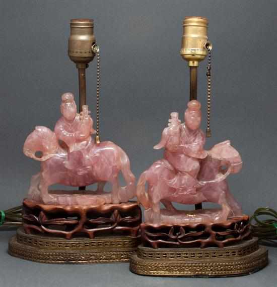 Appraisal: Two Chinese carved pink quartz equestrian figures th century mounted