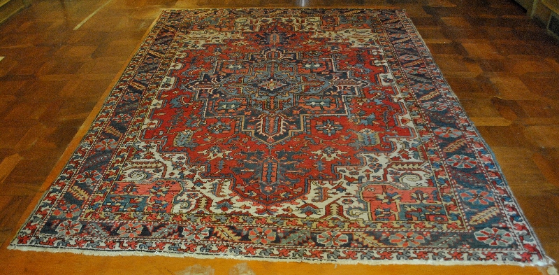 Appraisal: - Room size Heriz oriental carpet with red field x