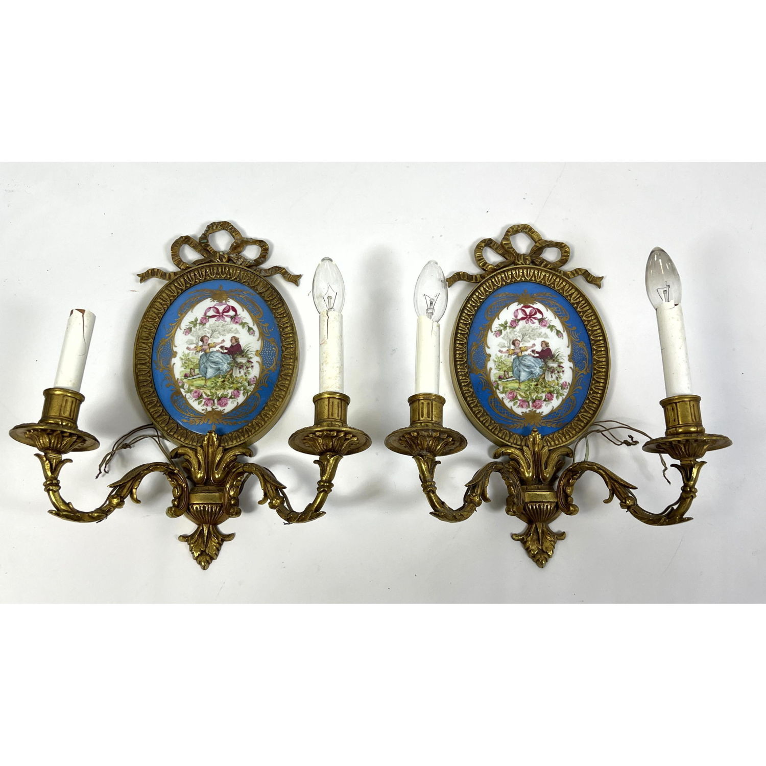 Appraisal: Pr Two Arm Brass Wall Sconces Oval Porcelain Medallion Element