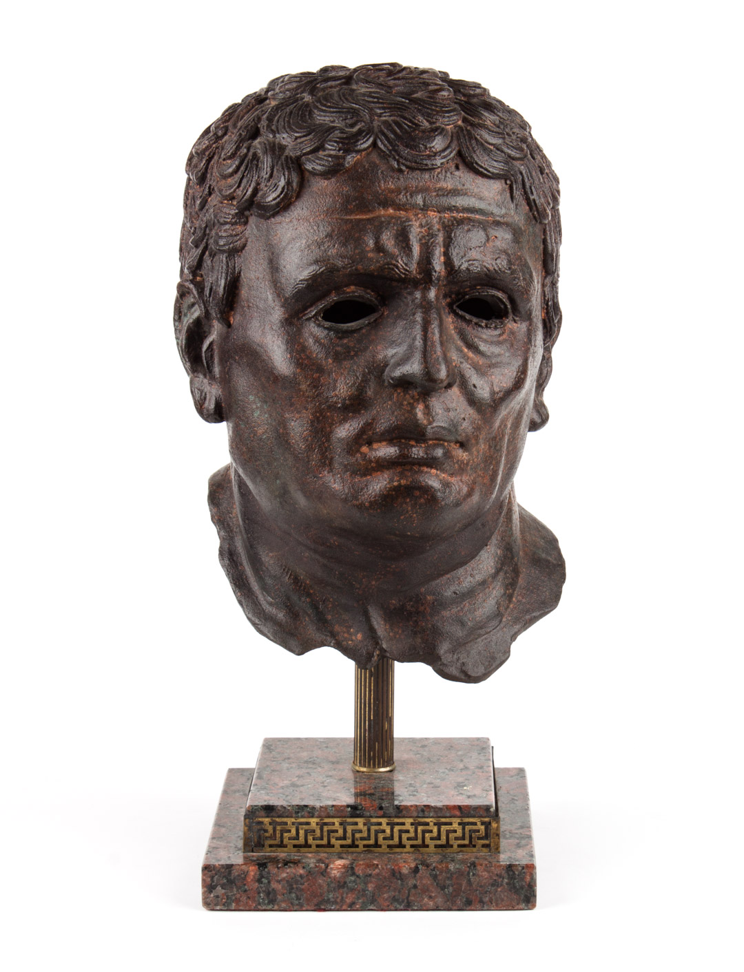 Appraisal: Cast iron bust of Caesar mounted on variegated marble base