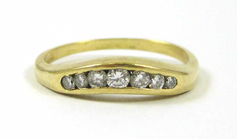 Appraisal: DIAMOND AND EIGHTEEN KARAT GOLD RING channel set with a