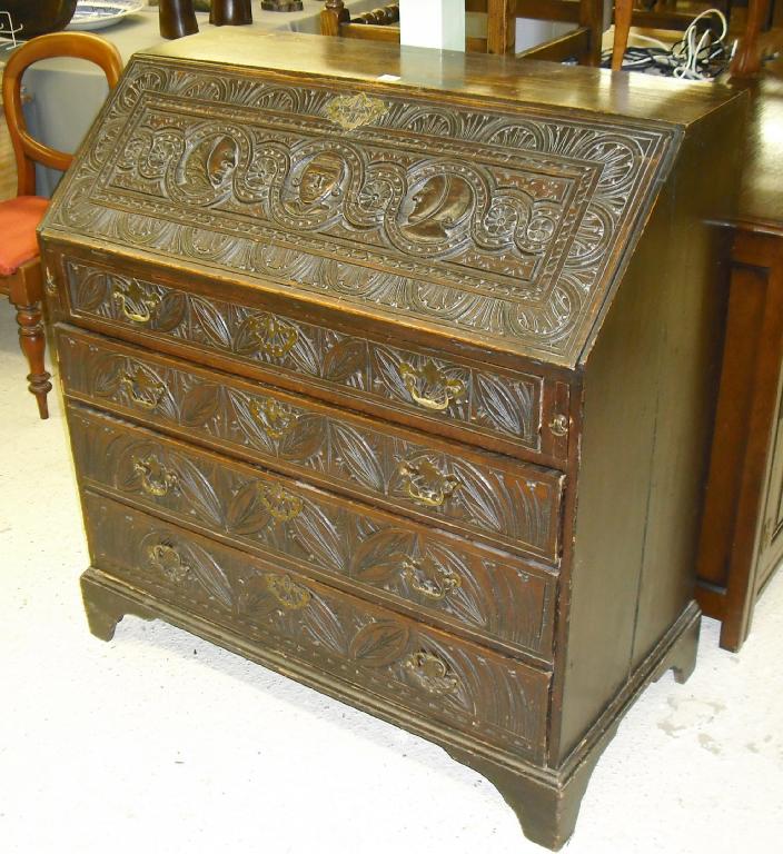 Appraisal: George III oak bureau the fall front opening to reveal