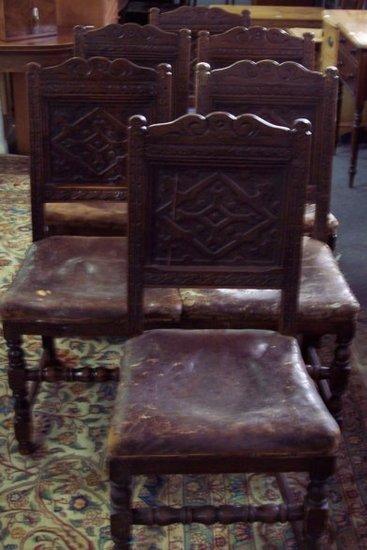 Appraisal: A set of six Jacobean style oak panel back dining