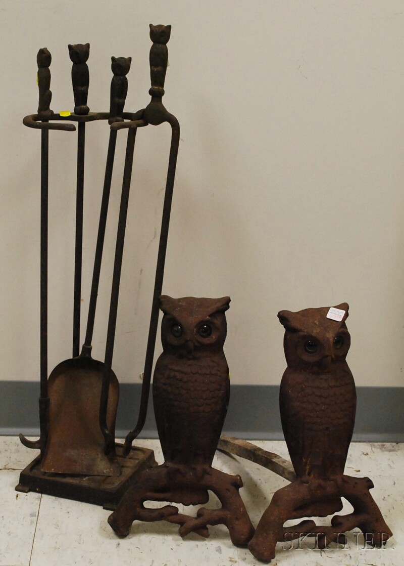 Appraisal: Pair of Cast Iron Owl Andirons with Glass Eyes and