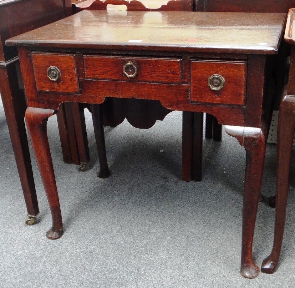 Appraisal: An th century and later oak lowboy with three frieze