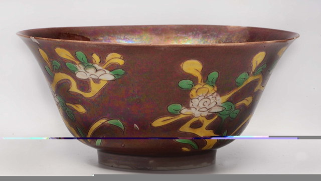 Appraisal: A CHINESE AUBERGINE GLAZE BOWL decorated with three sprays of