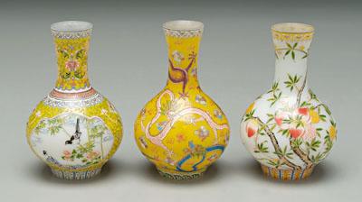 Appraisal: Three Chinese enameled glass vases bottle form white glass one