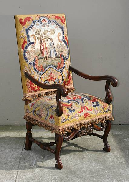 Appraisal: A Baroque style needlepoint upholstered walnut armchair mid th century