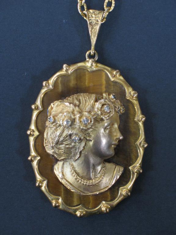 Appraisal: A LATE VICTORIAN PORTRAIT PENDANT the oval tigers eye ground