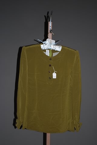 Appraisal: Andr Laug olive green long sleeve silk blouse with jeweled