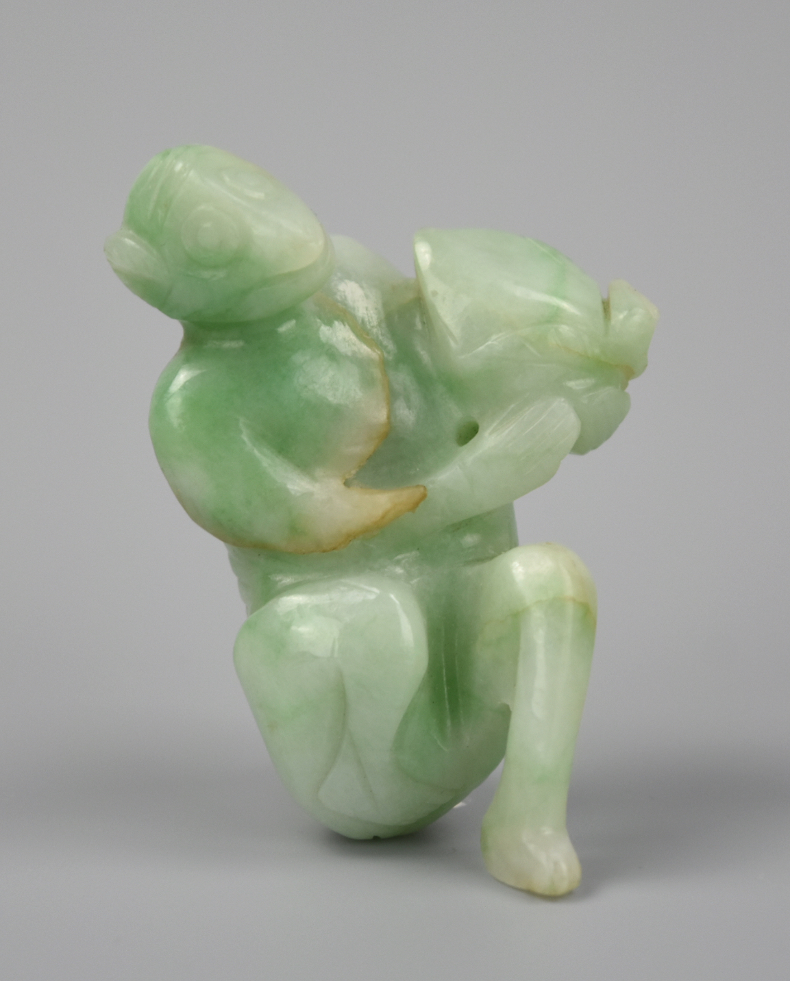 Appraisal: CHINESE JADEITE CARVING OF MONKEY W PEACH QING D A