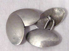 Appraisal: A pair of silver cufflinks circa