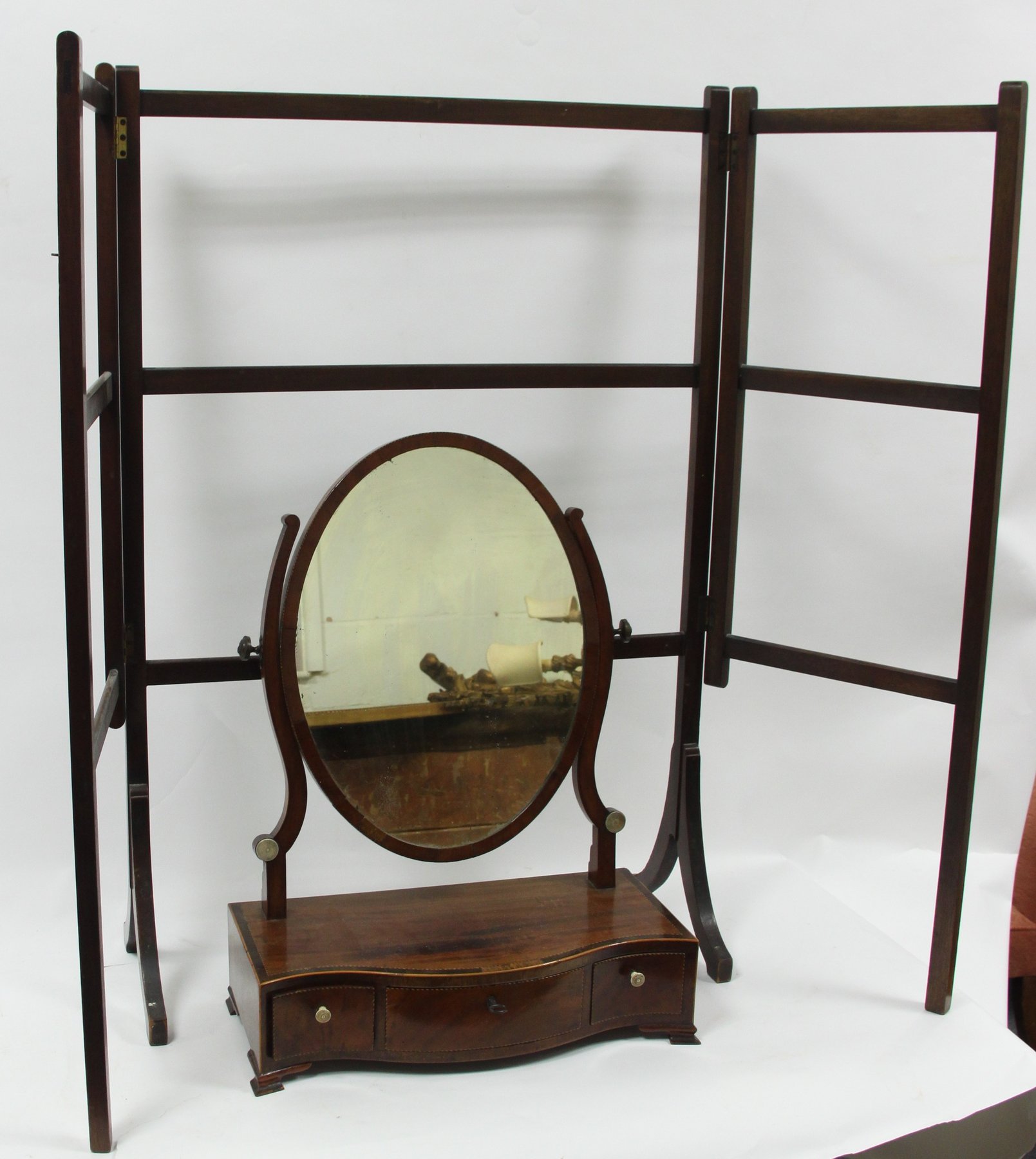 Appraisal: A th Century swing frame mirror the oval glass above