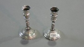 Appraisal: A pair of figural candlesticks