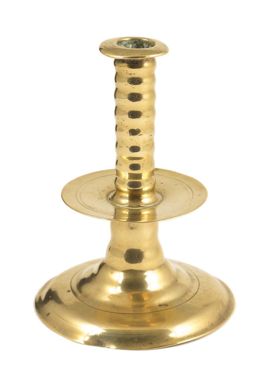 Appraisal: A Charles II brass trumpet candlestick