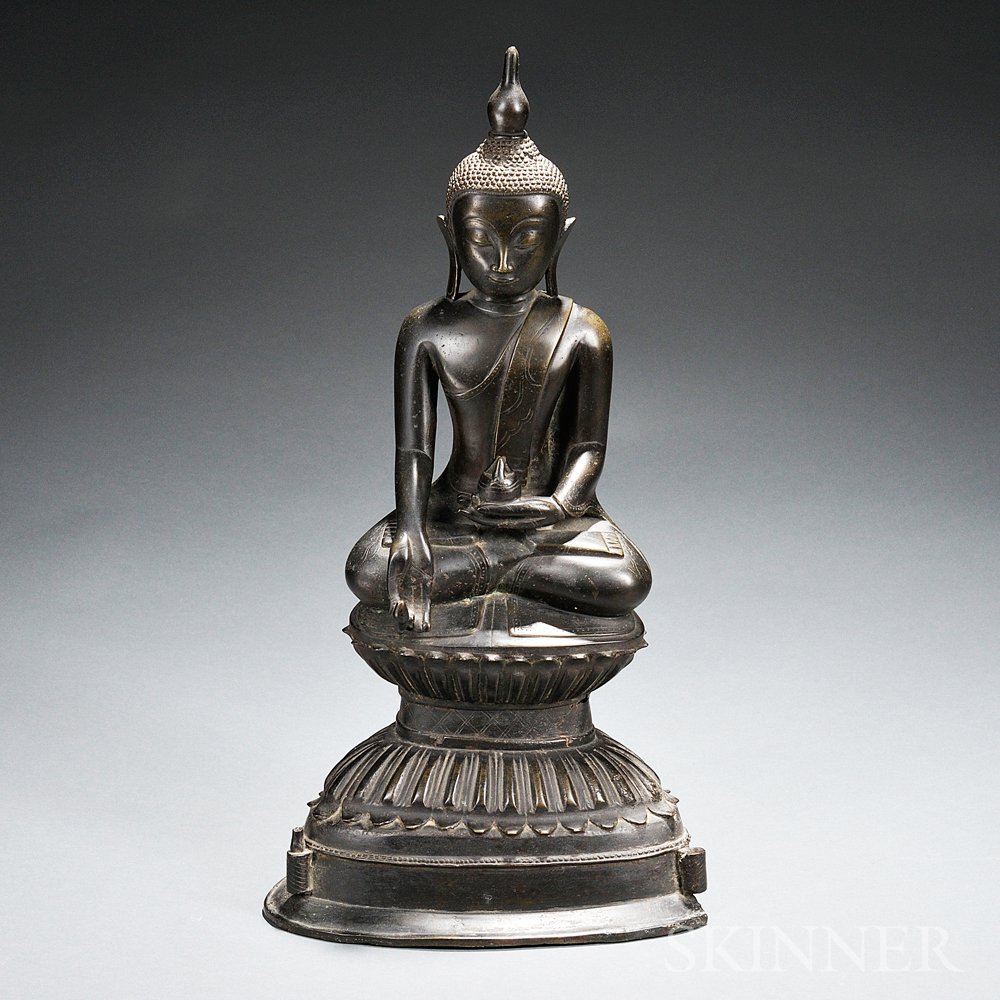 Appraisal: Bronze Buddha Thailand seated on a double lotus-style throne holding