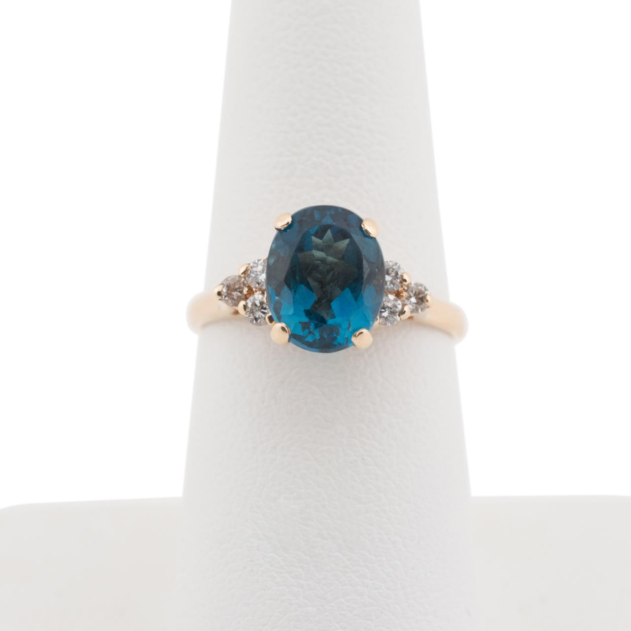 Appraisal: K YG LONDON BLUE TOPAZ DIAMOND RING k yellow gold