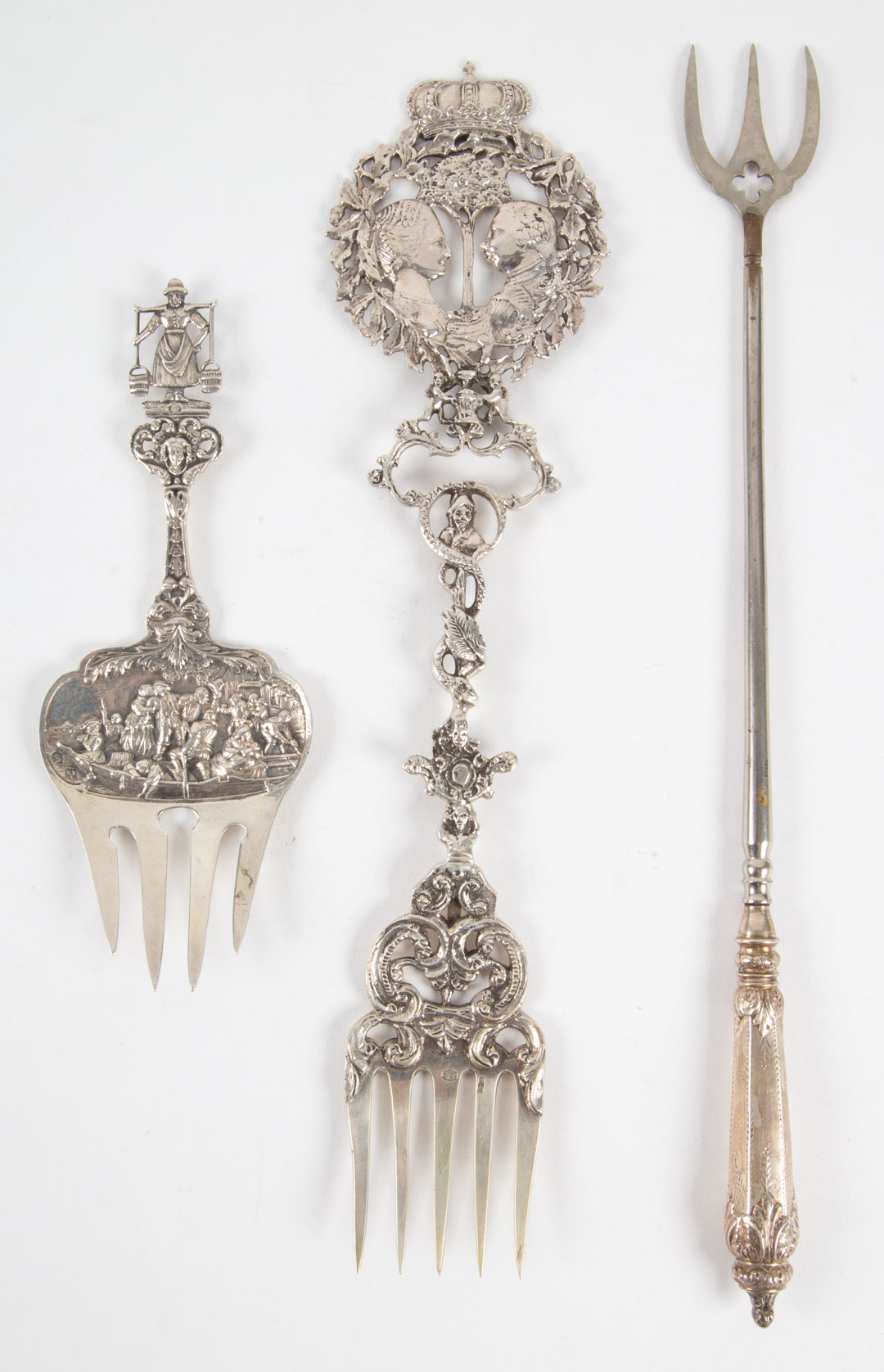 Appraisal: Two Dutch silver figural serving forks together with an English