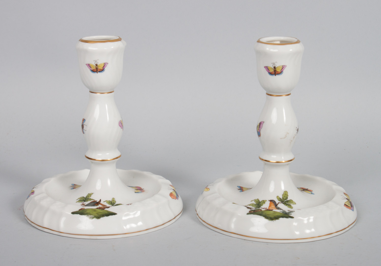 Appraisal: Pair of Herend porcelain candlesticks in the Rothschild Bird pattern