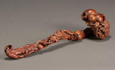 Appraisal: Chinese Bamboo Ruyi-Scepter th Century The gnarling stem-form shaft carved