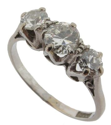 Appraisal: A diamond three stone ring Set with three circular cut