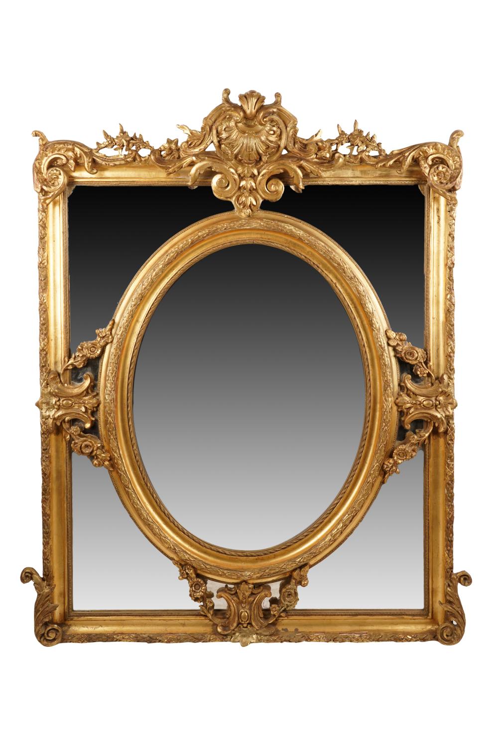 Appraisal: CONTINENTAL GILT MIRRORwith pierced crest over a central oval beveled