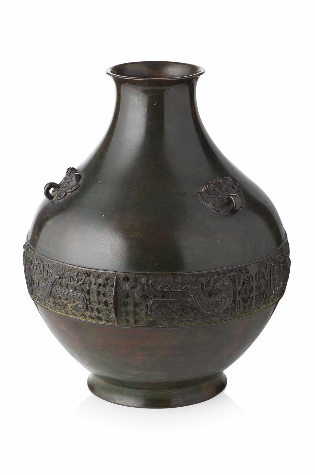 Appraisal: ARCHAISTIC BRONZE VASE the pear-shaped body with three mask handles