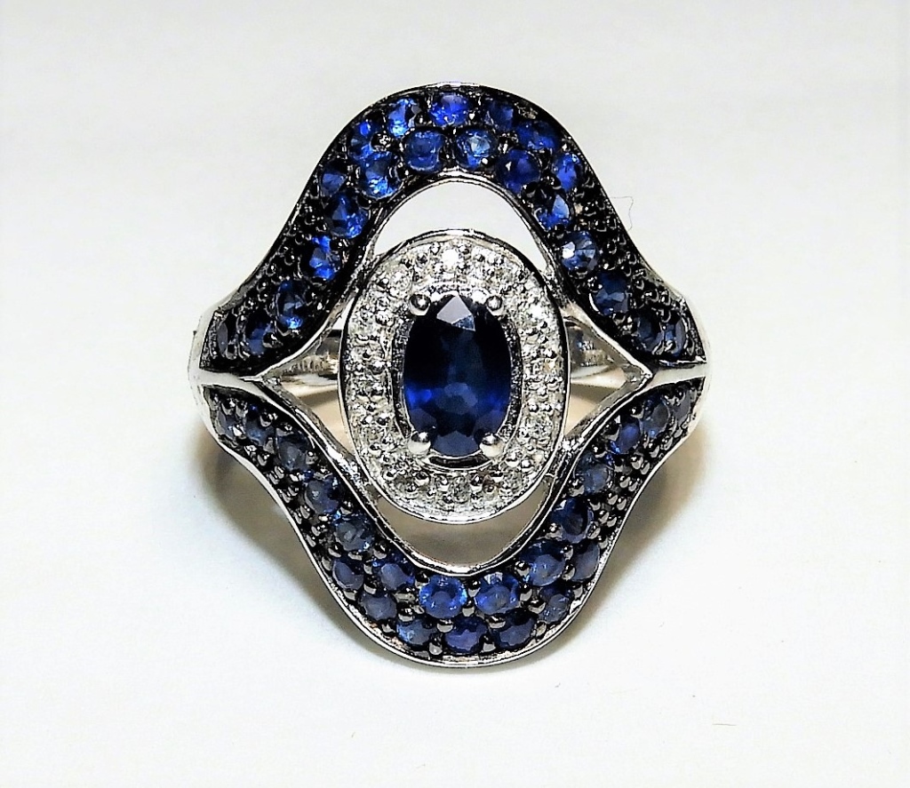 Appraisal: SAPPHIRE DIAMOND LADY'S K GOLD RING China ContemporaryOval cut center