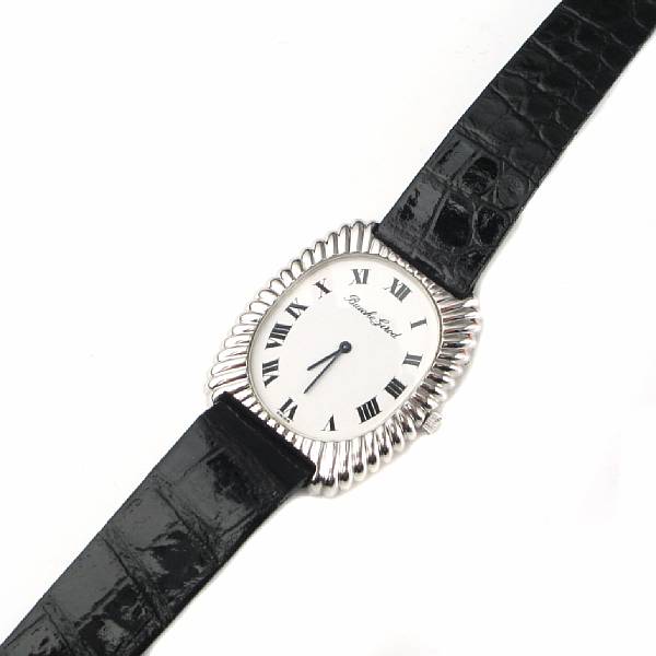 Appraisal: An k white gold fluted tonneau case wristwatch Beuche Girod